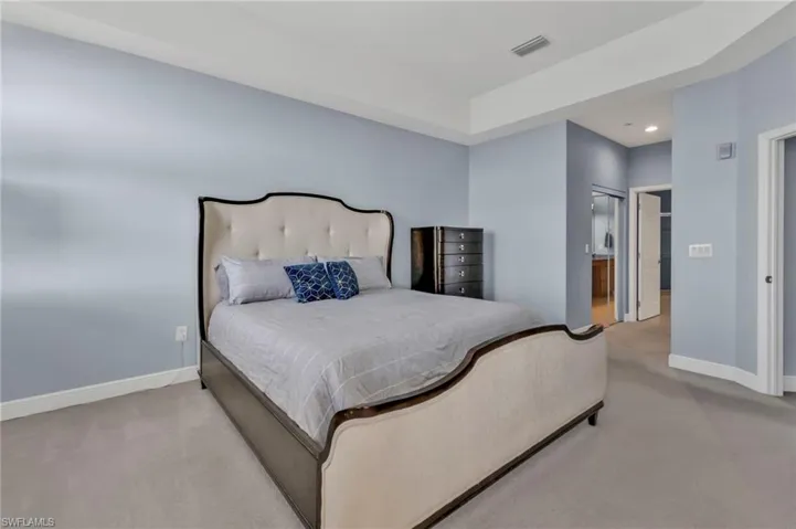 Bedroom featuring carpet floors, recessed lighting, visible vents, and baseboards