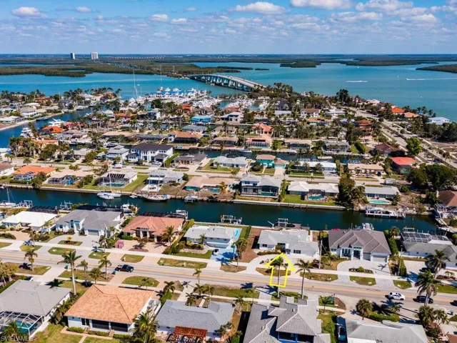 Drone / aerial view with a residential view and a water view