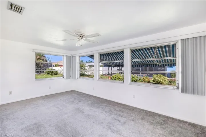 Florida Room ~ Great Light ~ New Retractable Awning and Flooring Added Recently