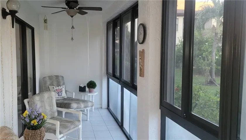 Sunroom featuring ceiling fan