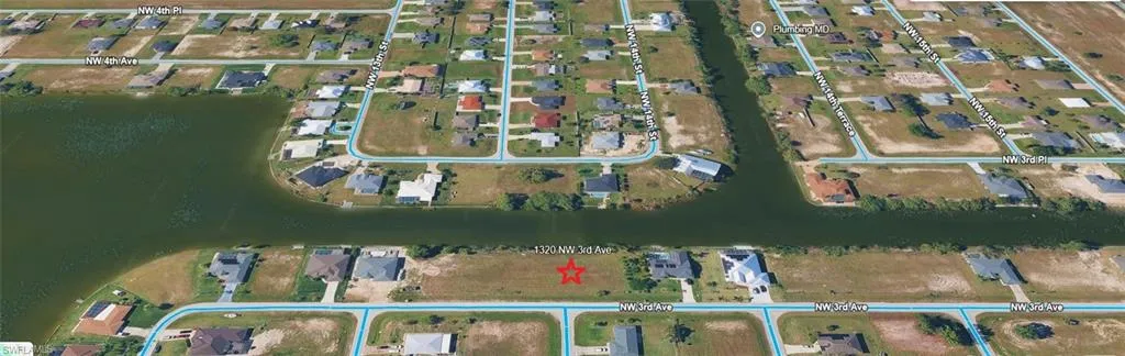 Aerial perspective of the property and the surrounding canals and lake.