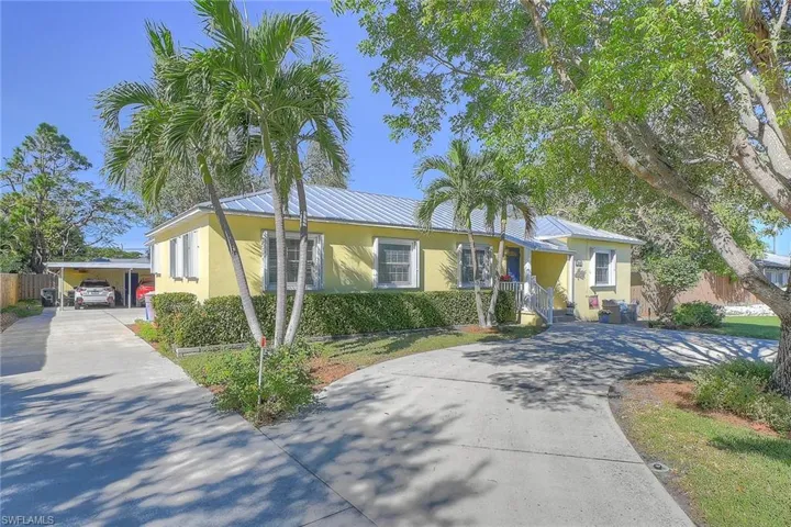 View of front of house with a carport