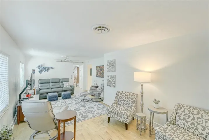Living room featuring light hardwood / wood-style flooring and ceiling fan