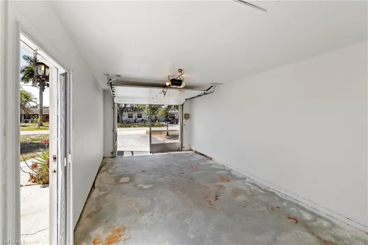 Garage featuring a garage door opener
