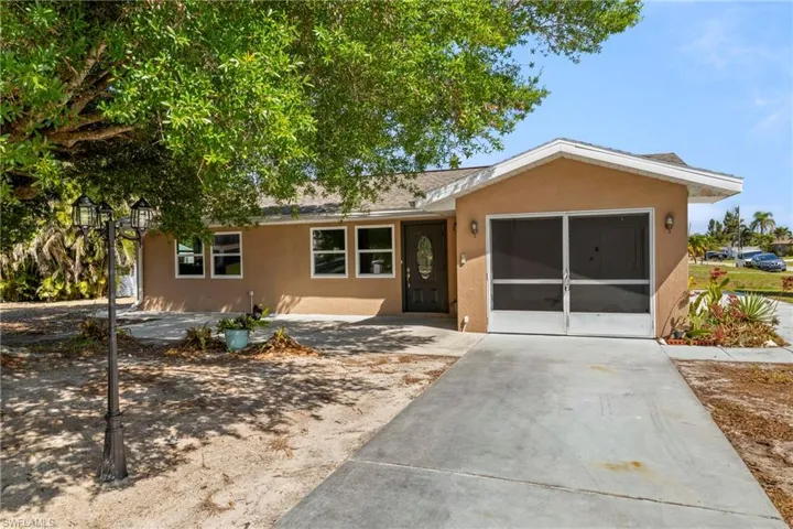 Single story home featuring stucco siding