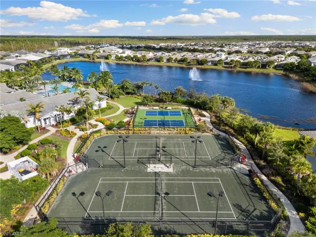 Aerial perspective of suburban area featuring a large body of water
