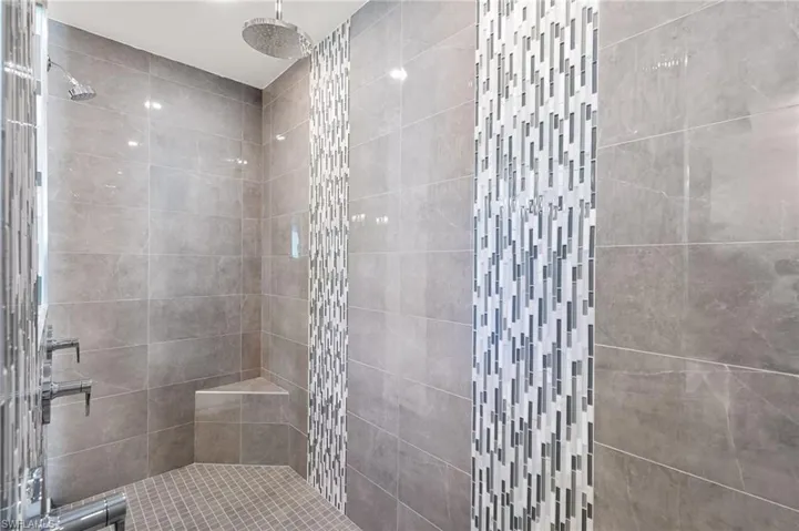 Bathroom featuring tiled shower