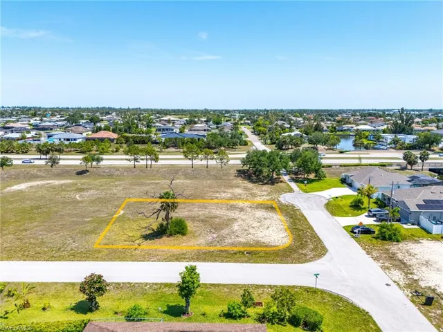 Aerial view of residential area with property boundaries highlighted