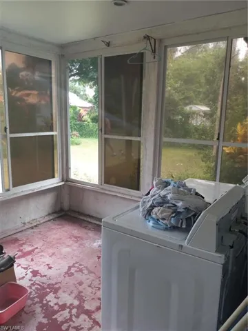 Washroom featuring washer / dryer