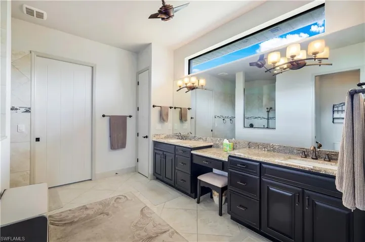 Bathroom featuring vanity and tile patterned floors