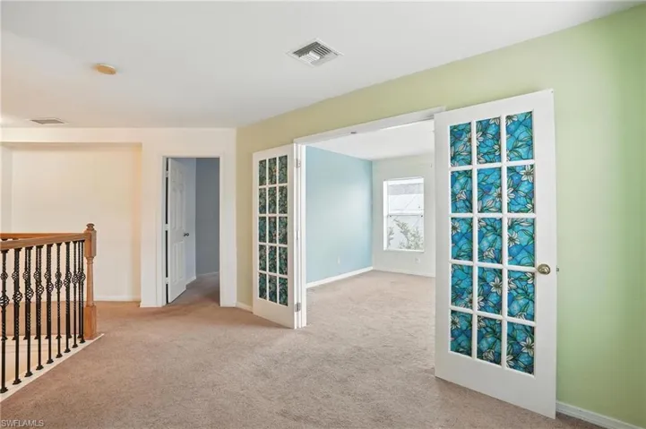 Unfurnished room with carpet and baseboards