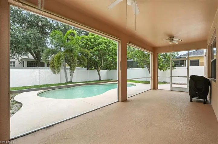 View of pool featuring ceiling fan, a fenced backyard, a patio, and area for grilling