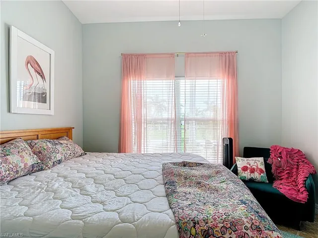Bedroom featuring multiple windows