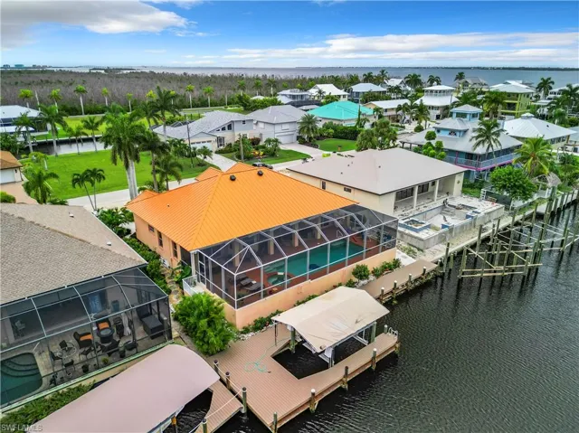 Aerial perspective of suburban area with a nearby body of water