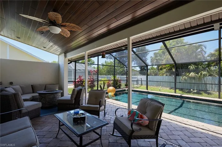View of swimming pool featuring a fenced backyard, an outdoor hangout area, a patio, and pool