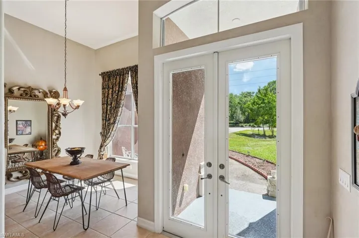 Doorway featuring french doors and tile patterned floors