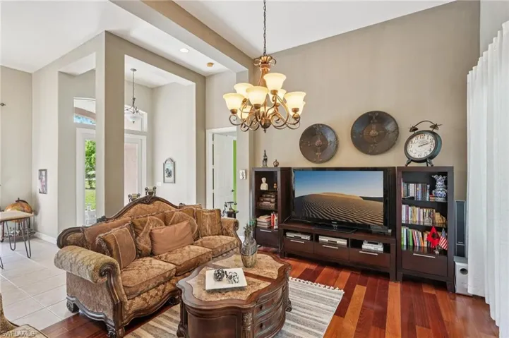 Living room with a chandelier and baseboards