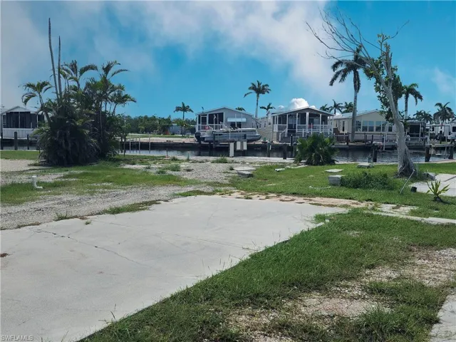 View of yard featuring a water view and a residential view
