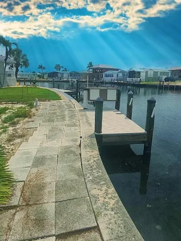 Dock area featuring a water view and a residential view