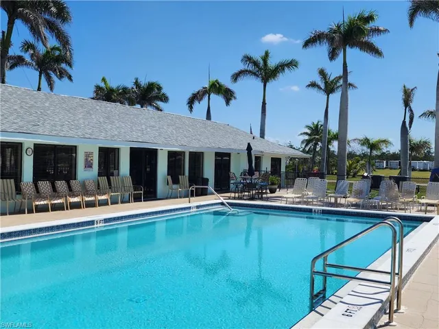 Community pool with a patio area