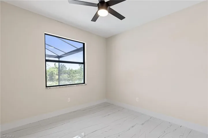 Spare room with ceiling fan