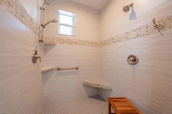 Bathroom with a tile shower