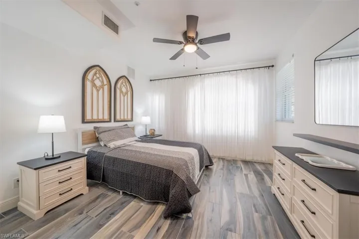 Bedroom featuring wood finished floors and ceiling fan