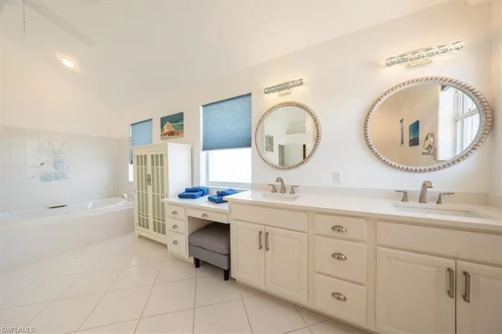 Master bathroom featuring a garden tub and double vanity