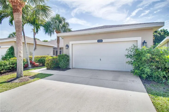 Garage featuring driveway