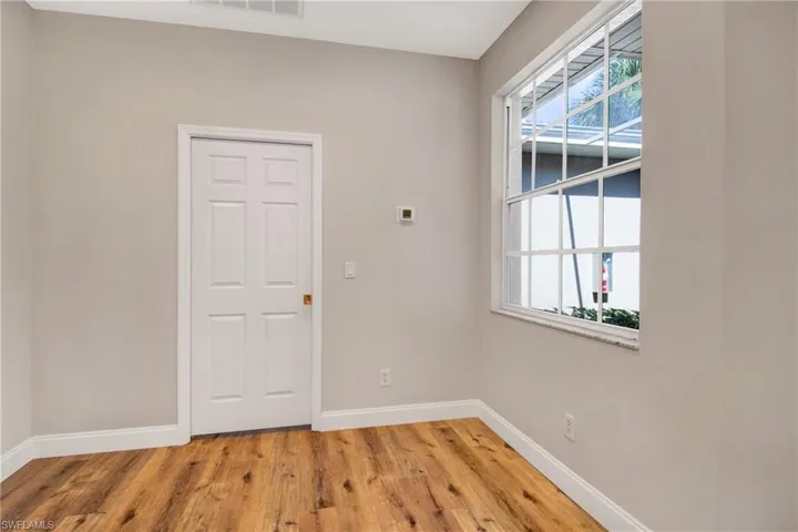 Entryway featuring baseboards and light wood finished floors