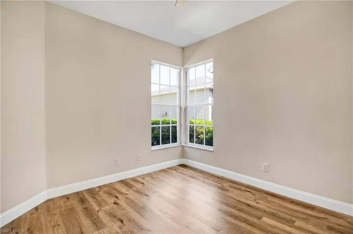 Unfurnished room featuring light wood-style flooring and baseboards