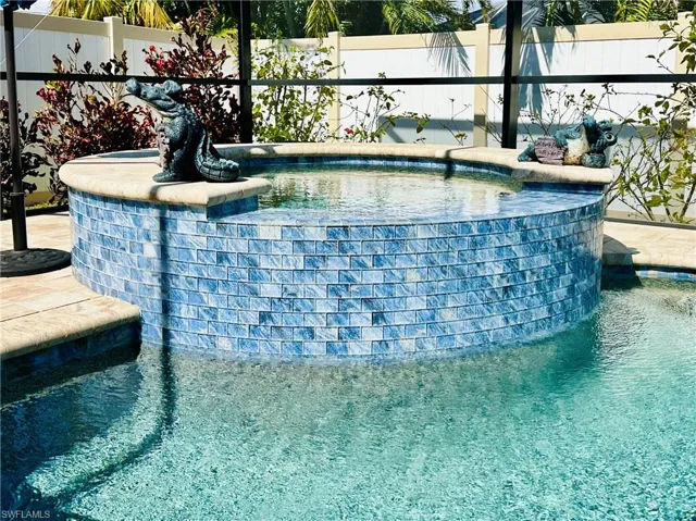 Outdoor pool with a hot tub
