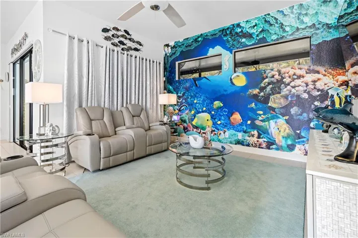 Living area featuring a ceiling fan