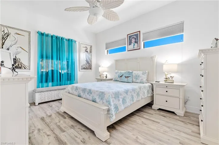 Bedroom featuring light wood-type flooring and ceiling fan
