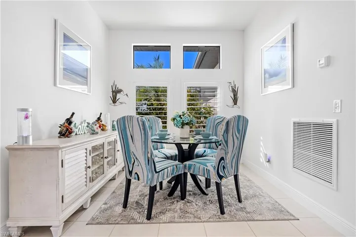 Dining room with baseboards and tile patterned floors