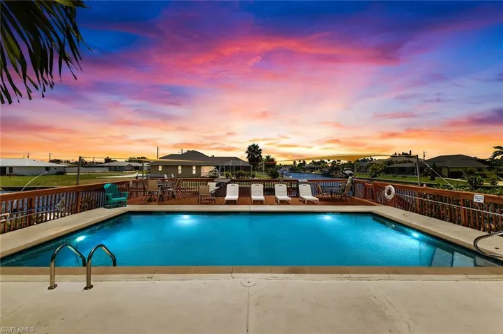 View of pool at dusk