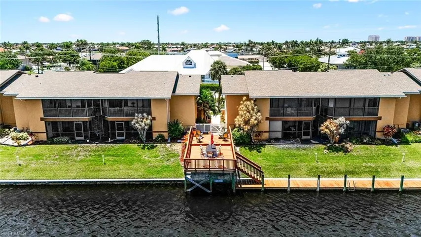 Back of property featuring a water view
