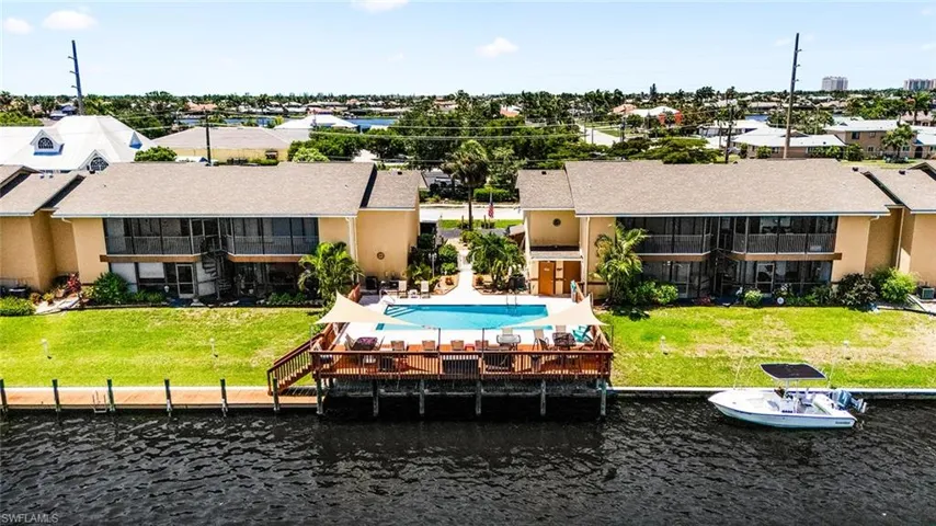 Back of property featuring a water view