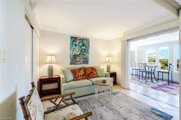 Tiled living room with crown molding