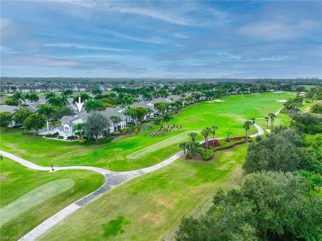 Aerial perspective of suburban area featuring a local golf course