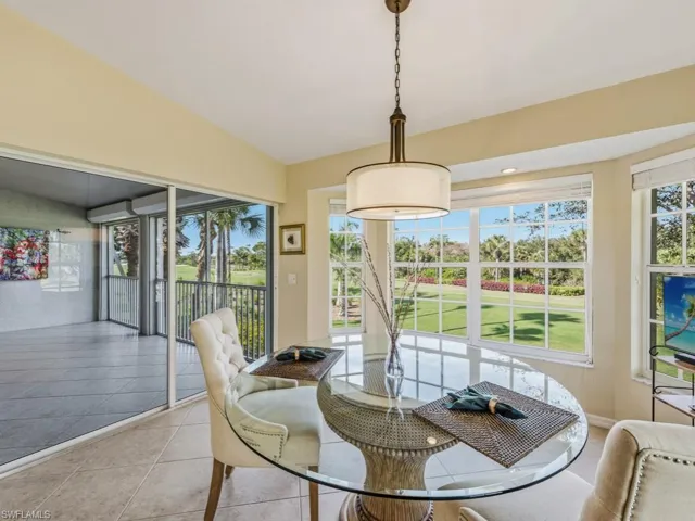 Dining area featuring light tile patterned floors and plenty of natural light