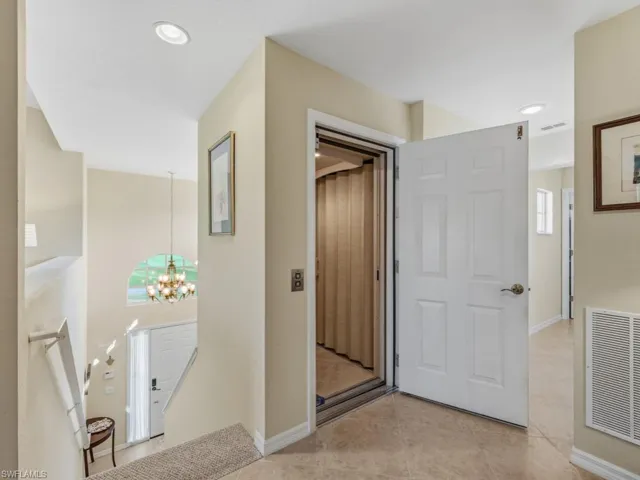 Hall featuring a chandelier, an upstairs landing, light tile patterned floors, and recessed lighting