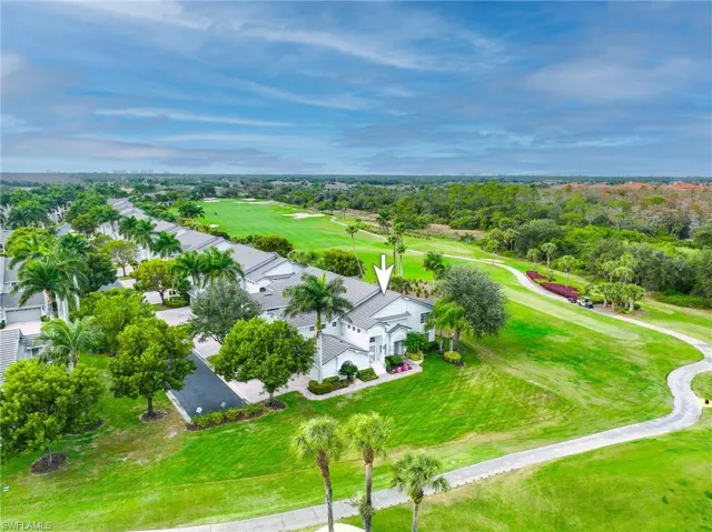 Bird's eye view of property and golf course