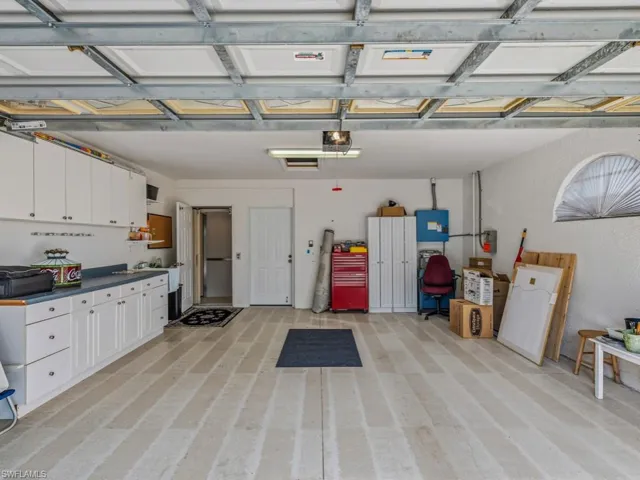 Garage featuring a garage door opener