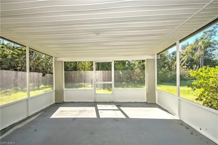 Unfurnished sunroom featuring plenty of natural light
