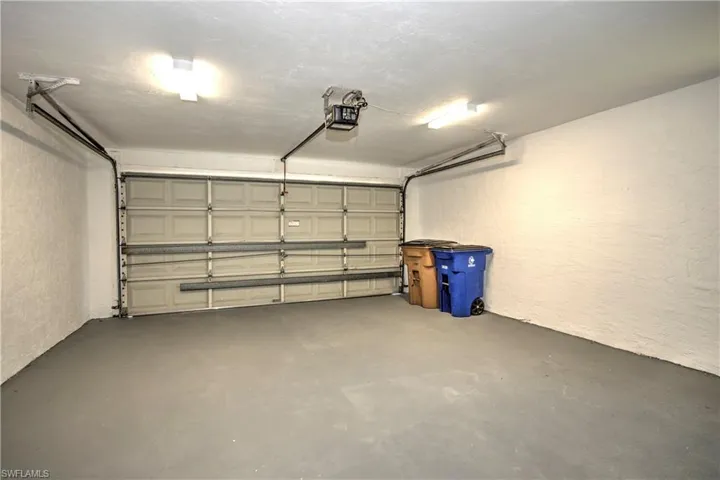 Garage featuring a garage door opener