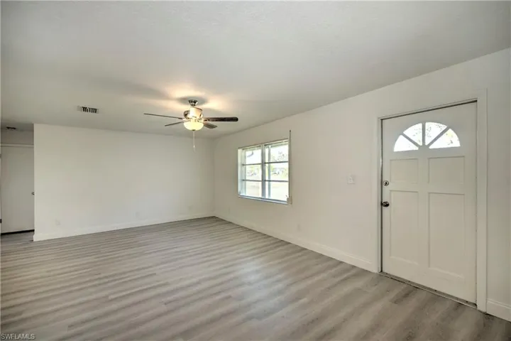 Entrance foyer featuring ceiling fan and light hardwood / wood-style floors