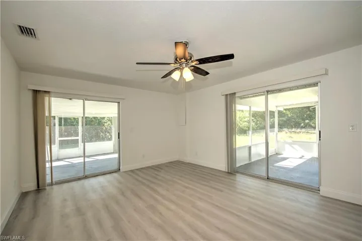 Spare room featuring light hardwood / wood-style flooring and ceiling fan