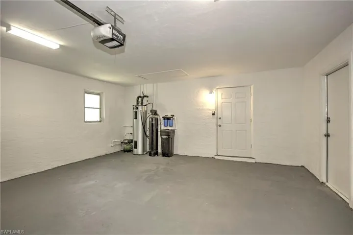 Garage with a garage door opener and water heater