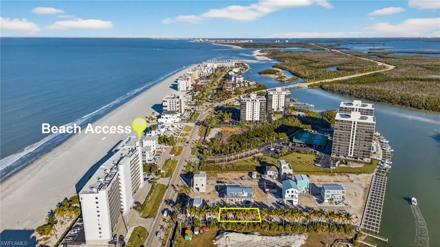 Coastal land parcel featuring mature palm trees, proximity to the shoreline, and defined boundaries